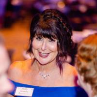 President Philomena Mantella at her table